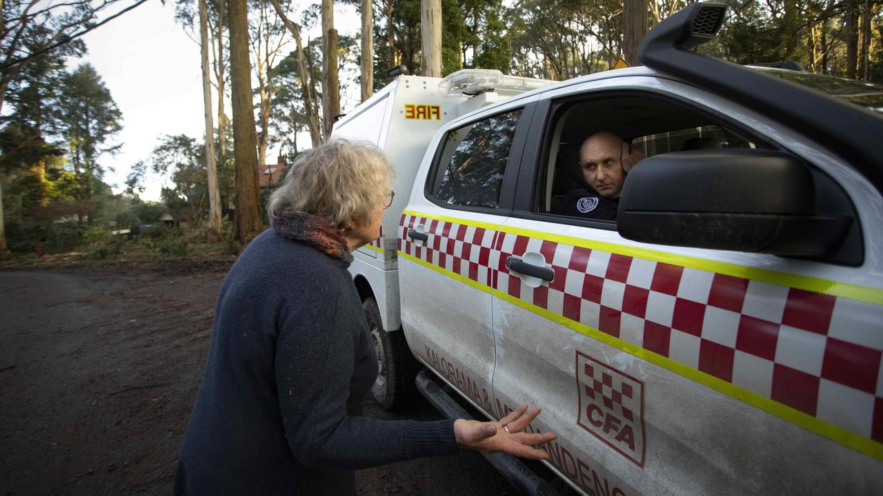 Kalorama resident Pam, who lives on Ridge Rd, speaks to CFA volunteer Shayne O’Dwyer. Picture: Arsineh Houspian