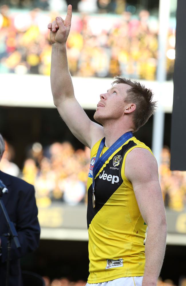 For you, Maddie: Jack Riewoldt points to the sky after his receiving his premiership medal. Picture: Michael Klein