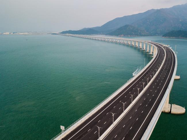 TOPSHOT - An aerial view taken on October 22, 2018, shows a section of the Hong Kong-Zhuhai-Macau Bridge (HKZM) in Hong Kong. - The world's longest sea-bridge connecting Hong Kong, Macau and mainland China will be launched October 23, at a time when Beijing seeks to tighten its grip on its territories. (Photo by Anthony WALLACE / AFP)