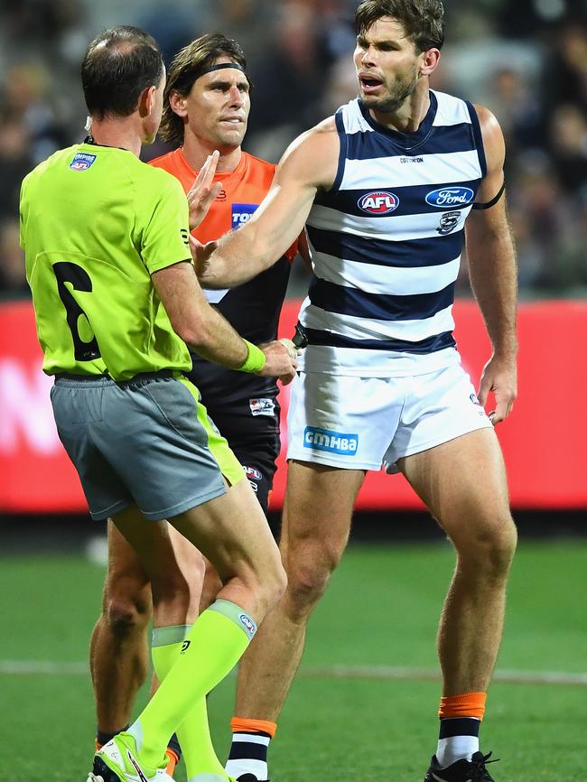 Tom Hawkins and the umpire on Friday night. Picture: Quinn Rooney/Getty Images