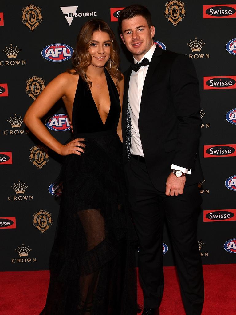 Richmond’s Jack Higgins and partner Tenisha Cook. Picture: AAP