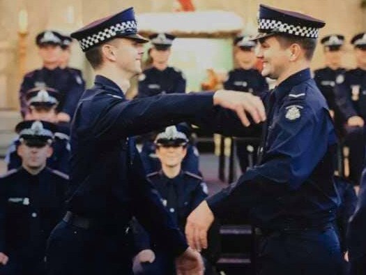 Josh Prestney (left) with his brother Alex at his graduation from police college. Prestney was killed, along with three other Victorian police officers, when they were hit by a truck on a Melbourne freeway. Photograph: Victoria police