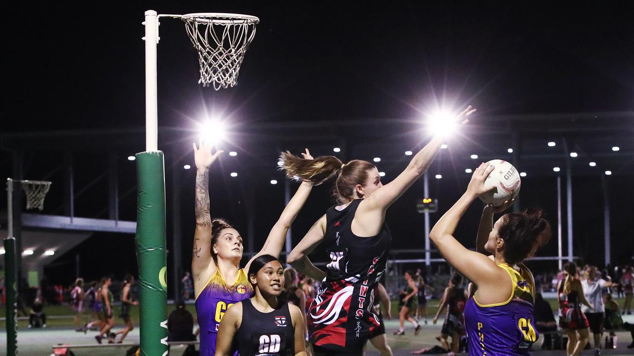 Fierce's Cayla George and Jade Kennedy dominate over the young Saints defenders in the Cairns Netball Association Senior Division 1 match between the Phoenix Fierce and the Cairns Saints. PICTURE: BRENDAN RADKE