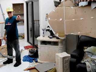 SHATTERED DREAM: Trevor Hickey, of Lennox Head, inspects the damage to his home in Stewart Street after it bore the brunt of the devastating tornado that struck the coastal community early yesterday morning. . Picture: Jay Cronan