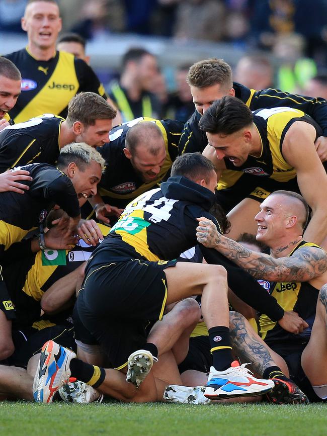 Richmond players embrace after the final siren. Picture: Mark Stewart