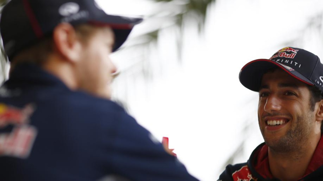 SAKHIR, BAHRAIN - APRIL 03: Sebastian Vettel of Germany and Infiniti Red Bull Racing and Daniel Ricciardo of Australia and Infiniti Red Bull Racing play a questions and answers game for a television channel during previews for the Bahrain Formula One Grand Prix at the Bahrain International Circuit on April 3, 2014 in Sakhir, Bahrain. (Photo by Andrew Hone/Getty Images) *** Local Caption *** Sebastian Vettel; Daniel Ricciardo