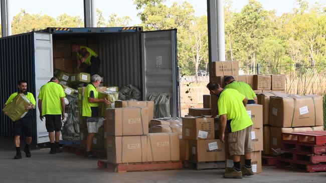 Workers unloading a container at the airport’s new cold storage and freight facility. Picture: Katrina Bridgeford