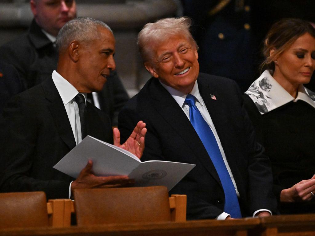 Obama and Trump engaged in a good-natured chat. (Photo by Ricky Carioti / AFP)