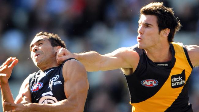 Richmond's David Gourdis tackles Eddie Betts of Carlton, during their round 20 match of the AFL season, played at the MCG, in Melbourne, Saturday, Aug. 14, 2010. (AAP Image/ Joe Castro) NO ARCHIVING, EDITORIAL USE ONLY