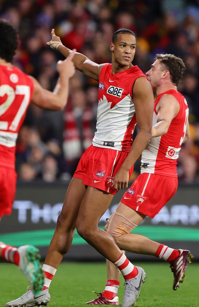 Joel Amartey celebrates kicking one of nine goals against Adelaide on Saturday night. Picture: Sarah Reed/AFL Photos via Getty Images.