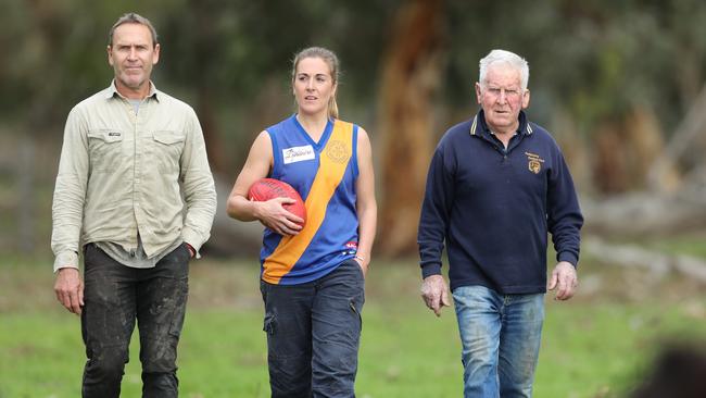 Casey McElroy, 27, on the family farm at Marcollat with her dad Bradley, 52, and grandfather Jeffrey, 81. Picture: Tait Schmaal