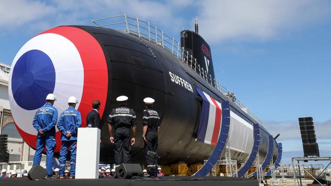 French President Emmanuel Macron, centre, launches the new French nuclear submarine Suffren in Cherbourg in 2019. Picture: AFP