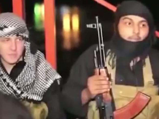 Australian Abdullah Elmir (left) in an Islamic State video.