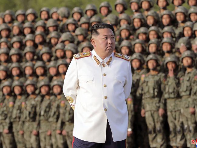 This picture taken on April 27, 2022 and released by North Korea's official Korean Central News Agency (KCNA) via KNS on April 29 shows North Korean leader Kim Jong Un taking part in a parade ceremony to mark the 90th founding anniversary of the Korean People's Revolutionary Army (KPRA), at an undisclosed location in North Korea. (Photo by KCNA VIA KNS / AFP) / South Korea OUT / ---EDITORS NOTE--- RESTRICTED TO EDITORIAL USE - MANDATORY CREDIT "AFP PHOTO/KCNA VIA KNS" - NO MARKETING NO ADVERTISING CAMPAIGNS - DISTRIBUTED AS A SERVICE TO CLIENTS / THIS PICTURE WAS MADE AVAILABLE BY A THIRD PARTY. AFP CAN NOT INDEPENDENTLY VERIFY THE AUTHENTICITY, LOCATION, DATE AND CONTENT OF THIS IMAGE --- /