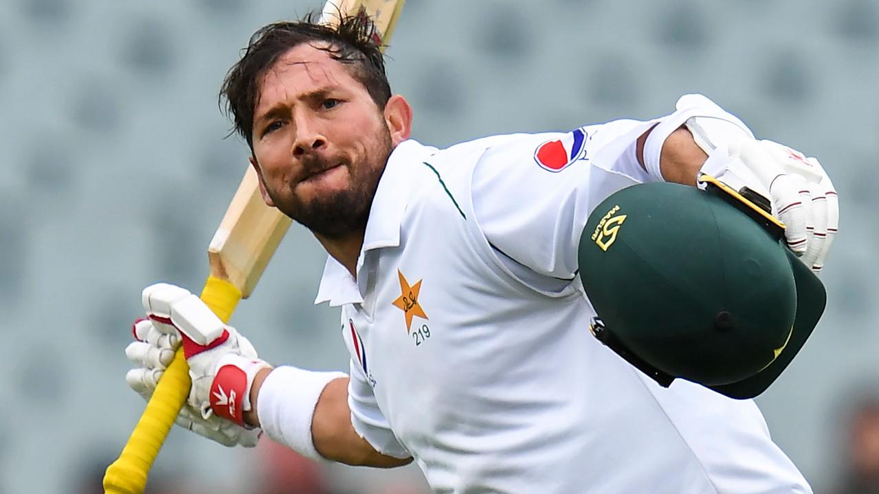 Pakistan batsman Yasir Shah celebrates scoring his century against Australia on the third day of the second cricket Test match in Adelaide.