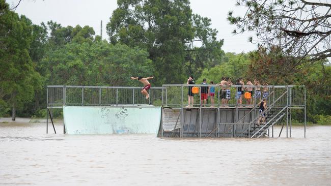 Children play during a flood event in Queensland in 2010. Photo: Mike Knott/NewsMail