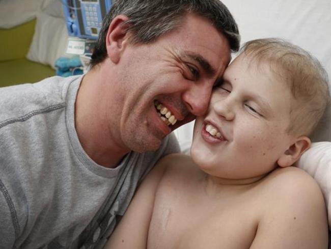 Tyler with his dad, Brad in hospital in 2013.