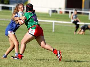 NEW ERA: Hervey Bay Seagulls forward Lakeyta Feste runs into the clutches of a Wallaroos player in a trial match earlier this year. Picture: Contributed
