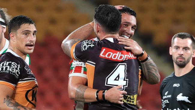 Jaydn Su'a and Darius Boyd come together after the Round 2 NRL game between the Brisbane Broncos and the South Sydney Rabbitohs at Suncorp Stadium, Brisbane. Pics Adam Head