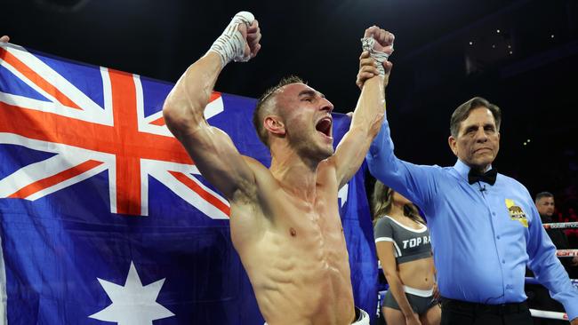 Jason Moloney roars as his hand is raised in victory. Picture: Getty Images