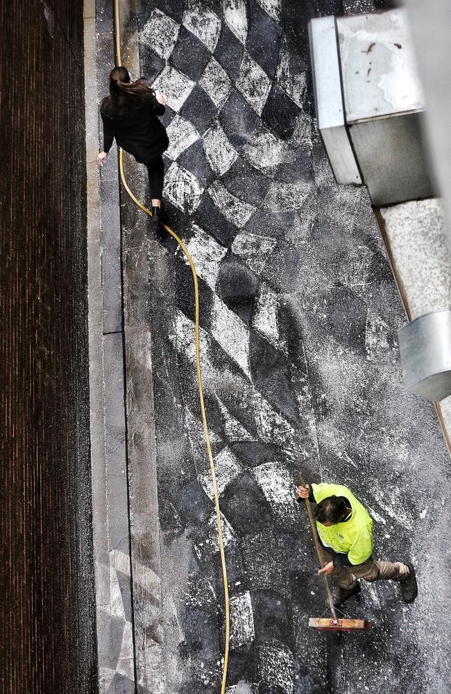 The cleaners at work this morning. Picture: Hamish Blair