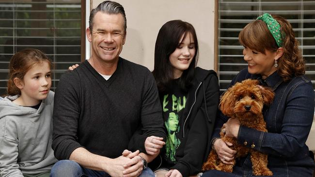 Australian singer Phil Burton at home with his son Xavier, daughter Willow and wife Justine. He hopes to mark Father’s Day with a nice, simple day. Picture: Sam Ruttyn