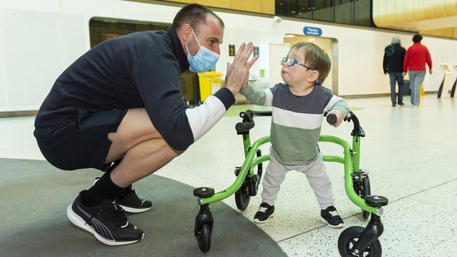 Mason Cheong high-fives Carlton’s Sam Docherty at the Royal Children's Hospital. Picture: Getty