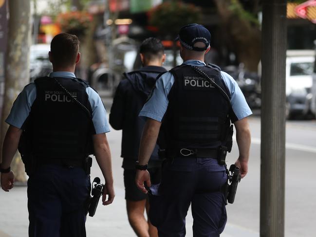 Police on Darlinghurst rd near the injecting room . picture John Grainger