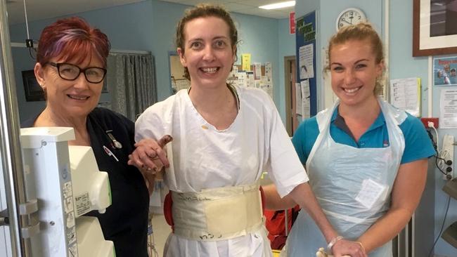 Before going back on life support, ICU nurses helped Sarah take some tentative first steps.
