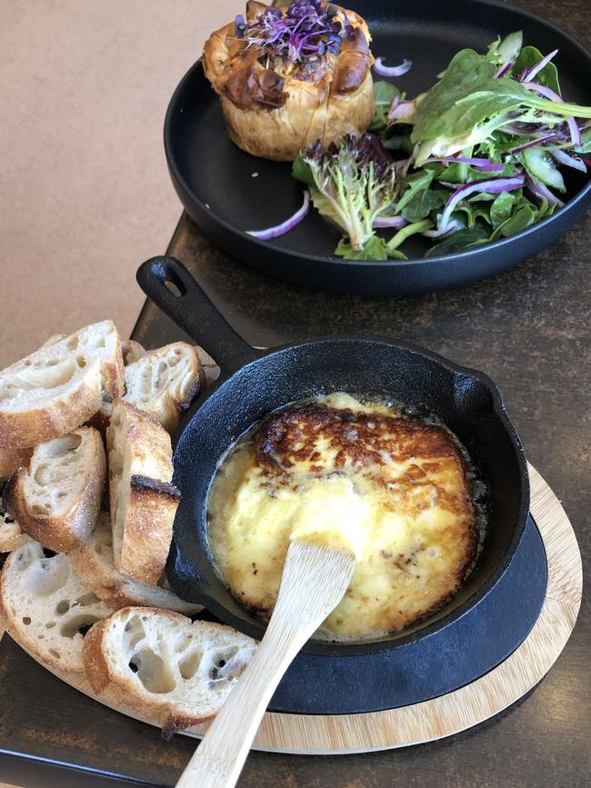 Heartlands Larder's fried cheese, delivered in a small cast-iron frying pan, has a perfectly seared crust and is easily smeared onto slices of Launceston’s Sweetwheat sourdough baguette. Picture: Alix Davis