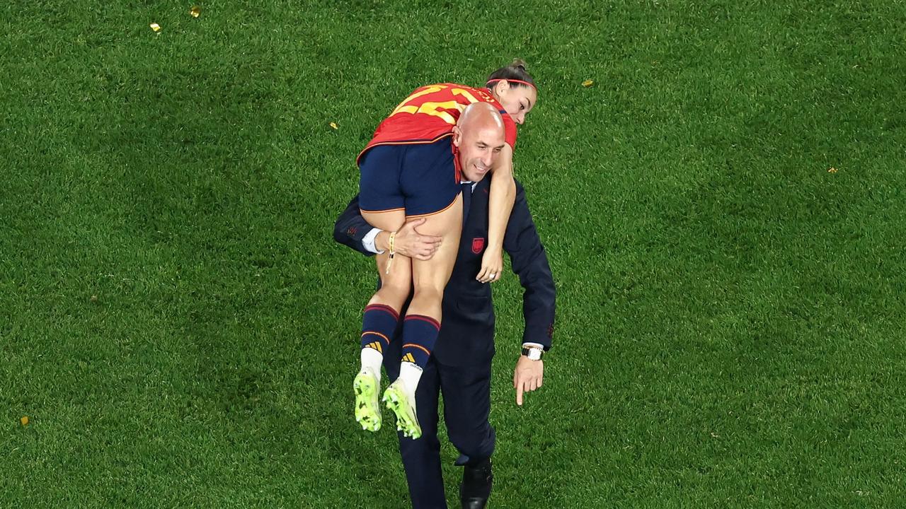 Luis Rubiales carrying Spain's Athenea del Castillo Beivide during World Cup celebrations. Photo by DAVID GRAY / AFP.