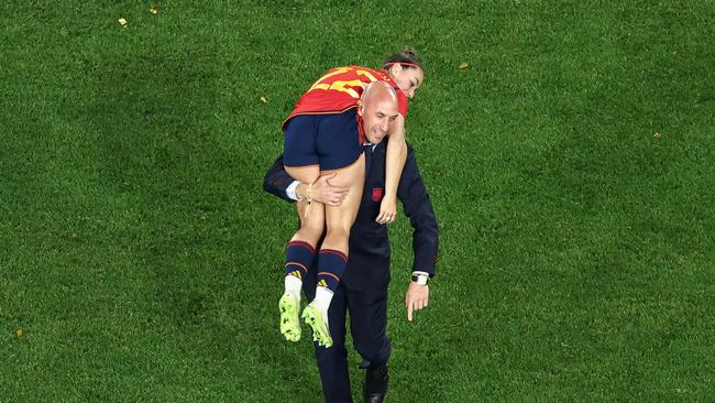 Luis Rubiales carrying Spain's Athenea del Castillo Beivide during World Cup celebrations. Photo by DAVID GRAY / AFP.