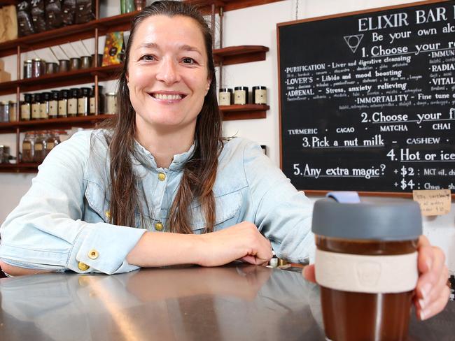 Orchard St Raw Takeway owner Marije Kleverlaan making a coffee into a keep cup. The cafe has signed up to Responsible Cafes, which means they give discounts to people who bring re-usuable cups, to reduce number going to landfill.