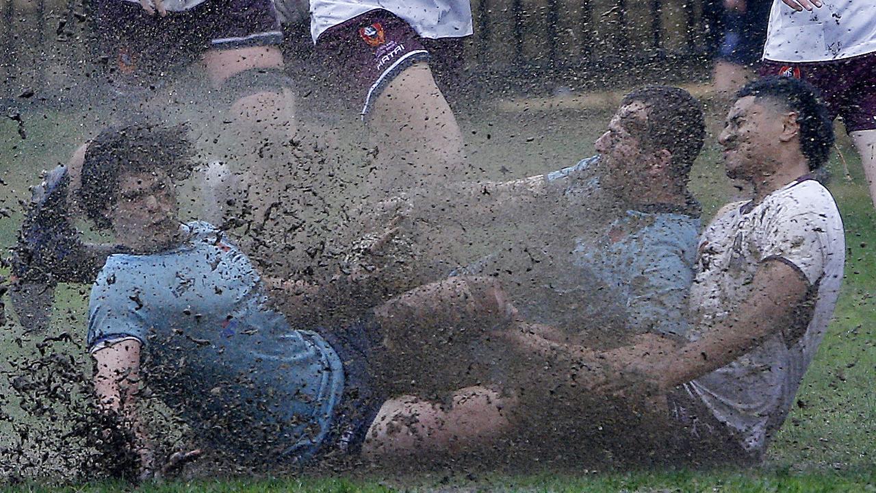 Muddy Collision for NSW's Leo Bassingthwaighte and Harry Darling and Queensland's Al Nanai Marsden at last year’s Australian School Rugby Championships. Pic: John Appleyard