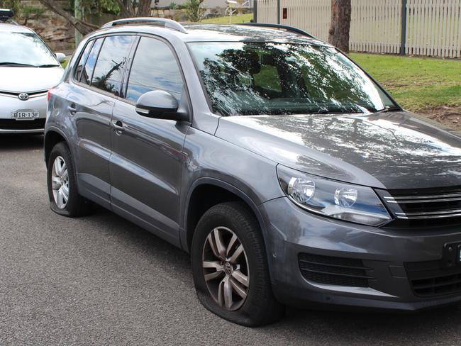 This car on Rosebery St had four flat tyres.