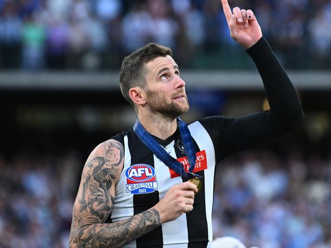 MELBOURNE, AUSTRALIA - SEPTEMBER 30: Jeremy Howe of the Magpies celebrates getting his Premiership medal during the 2023 AFL Grand Final match between Collingwood Magpies and Brisbane Lions at Melbourne Cricket Ground, on September 30, 2023, in Melbourne, Australia. (Photo by Quinn Rooney/Getty Images)