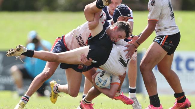 Tulsyn McCulloch tackling Curtis Lakeman. Picture: Sue Graham