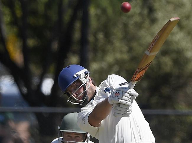 Lucas Agnoletto hits a four watched on by  Brent Kremer during the VSDCA: Croydon v Kew cricket match in Croydon, Saturday, Oct. 13, 2018.  Picture: Andy Brownbill