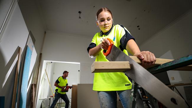 Elizabeth Hastings (18) a trainee with carpenter Darren Gregory working in the background of Darren Gregory Interiors at Fremantle. Picture: Colin Murty / The Australian