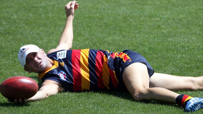 Matthew Bode stretches at Crows training.