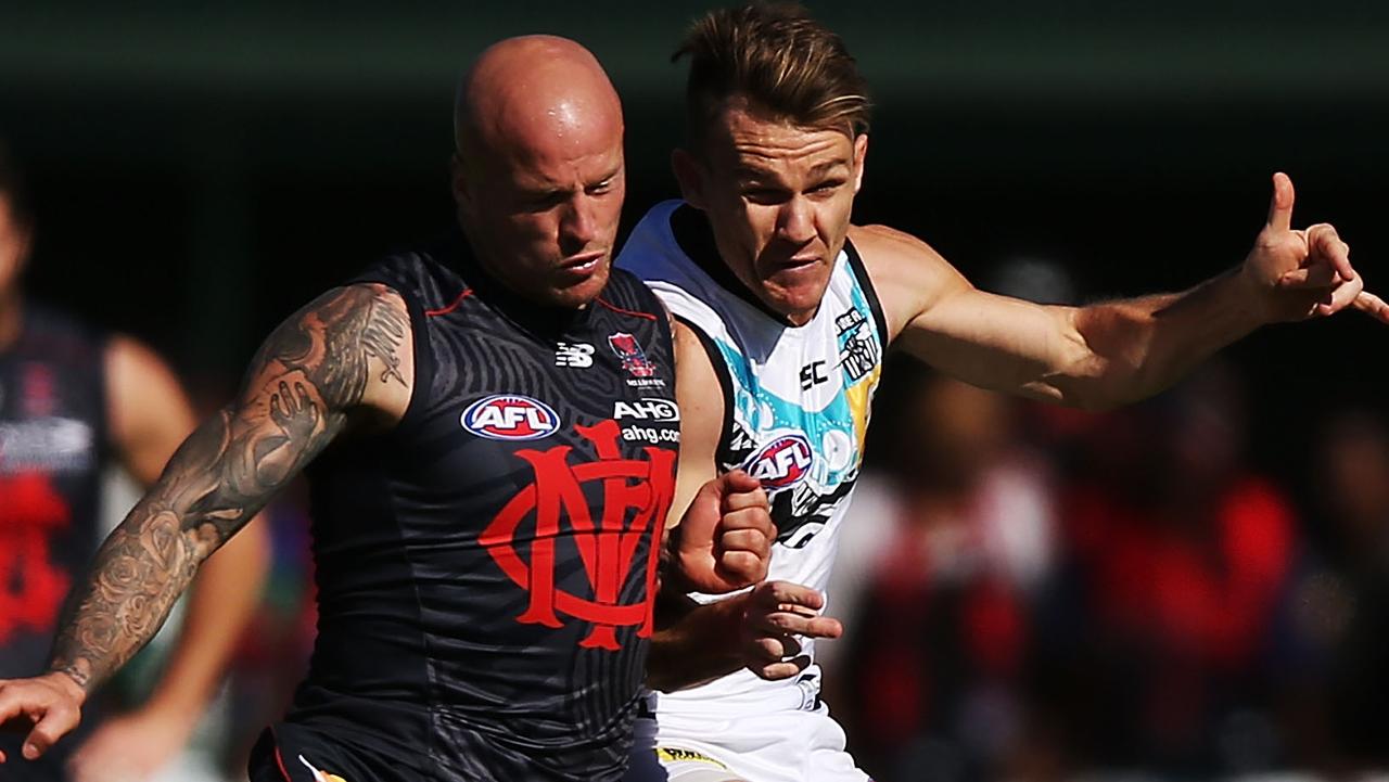 ALICE SPRINGS, AUSTRALIA - MAY 31: Nathan Jones (L) of the Demons and Robbie Gray of the Power compete for the ball during the round 11 AFL match between the Melbourne Demons and the Port Power at Traeger Park on May 31, 2014 in Alice Springs, Australia. (Photo by Michael Dodge/Getty Images)