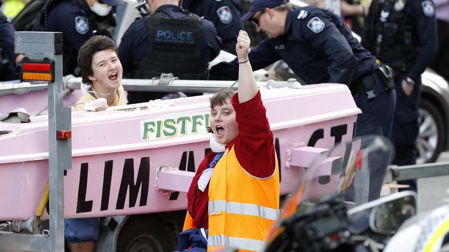 Extinction Rebellion protesters pictured at the corner of George and Elizabeth streets. Picture: Josh Woning/AAP