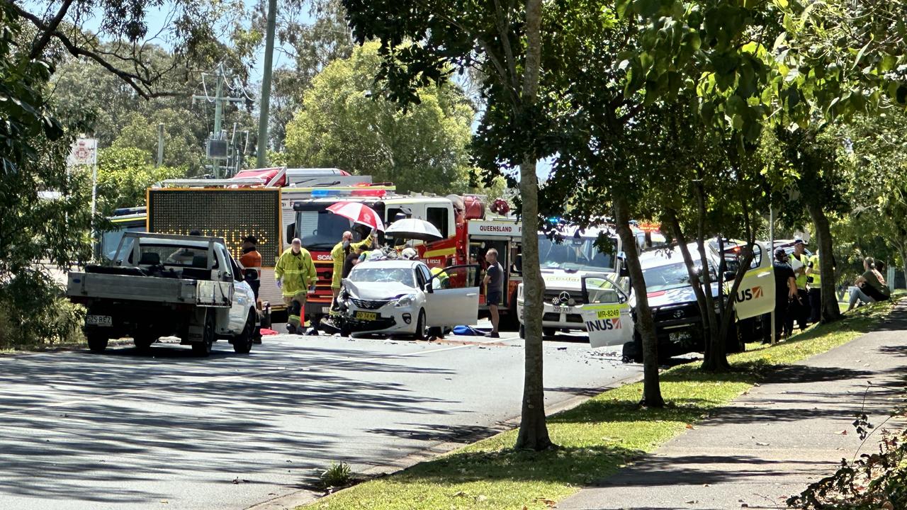 Woman trapped by legs in suburban smash near cop shop