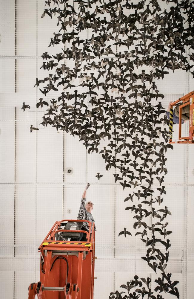 NGV art handlers install 10,000 porcelain birds for Cai Guo-Qiang’s Murmuration (Landscape). Picture: Eugene Hyland