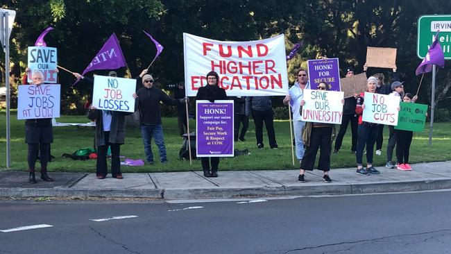 UOW staff protest against the job cuts on Thursday morning. Picture: Madeline Crittenden.