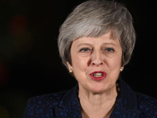 Britain's Prime Minister Theresa May makes a statement outside 10 Downing Street in central London after winning a confidence vote on December 12, 2018. (Photo by Oli SCARFF / AFP)