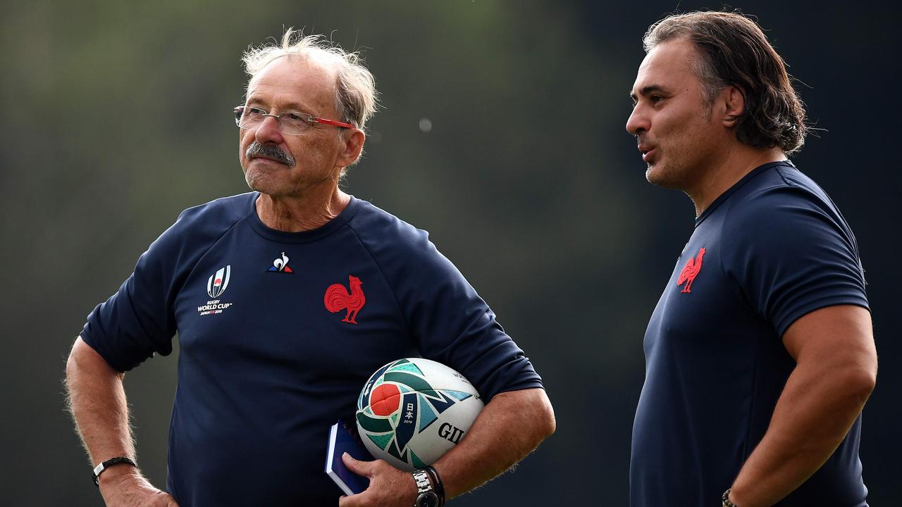 France coach Jacques Brunel speaks with assistant coach Sebastien Bruno.