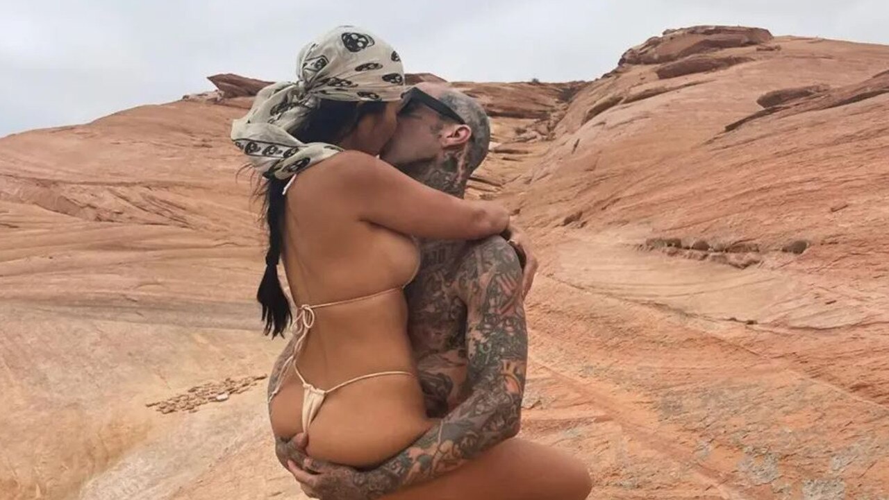 Kourtney Kardashian and Travis Barker, in the desert, doing what they do.