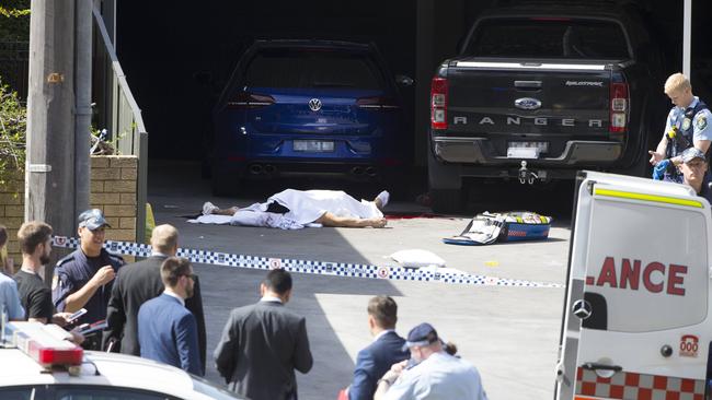 Assaad’s body in the driveway of his home.