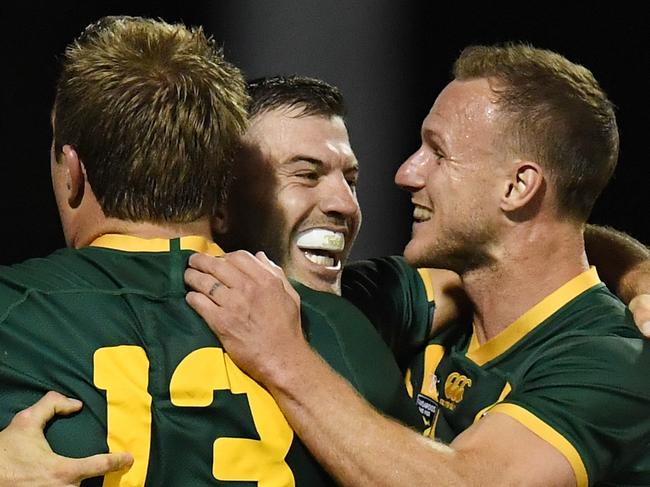 James Tedesco of the Kangaroos celebrates his try with team mates Jake Trbojevic and Daly Cherry-Evans after scoring a try during the Oceania Cup Test Match between Australia and New Zealand at WIN Stadium in Wollongong, Friday, October 25, 2019. (AAP Image/Dean Lewins) NO ARCHIVING, EDITORIAL USE ONLY